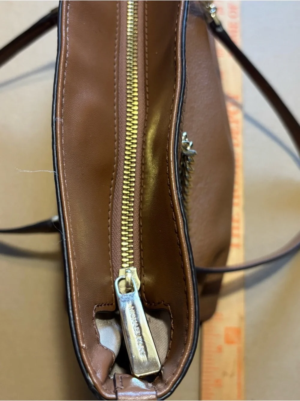 Michael Kors Cognac Pebbled Leather Tote with Gold Chain Straps zipper closure